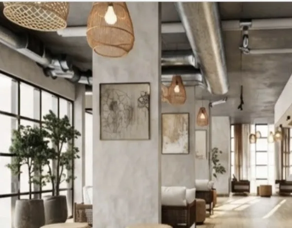 The Clara Tapestry lobby lounge with woven pendants and greenery